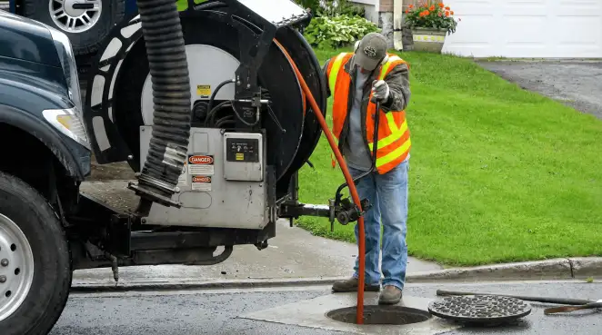 Technician using specialized drainage equipment for sewer line cleaning and foundation protection in Pasadena, CA