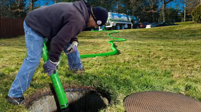 Service technician performing residential septic pumping and drainage maintenance in Pasadena, CA